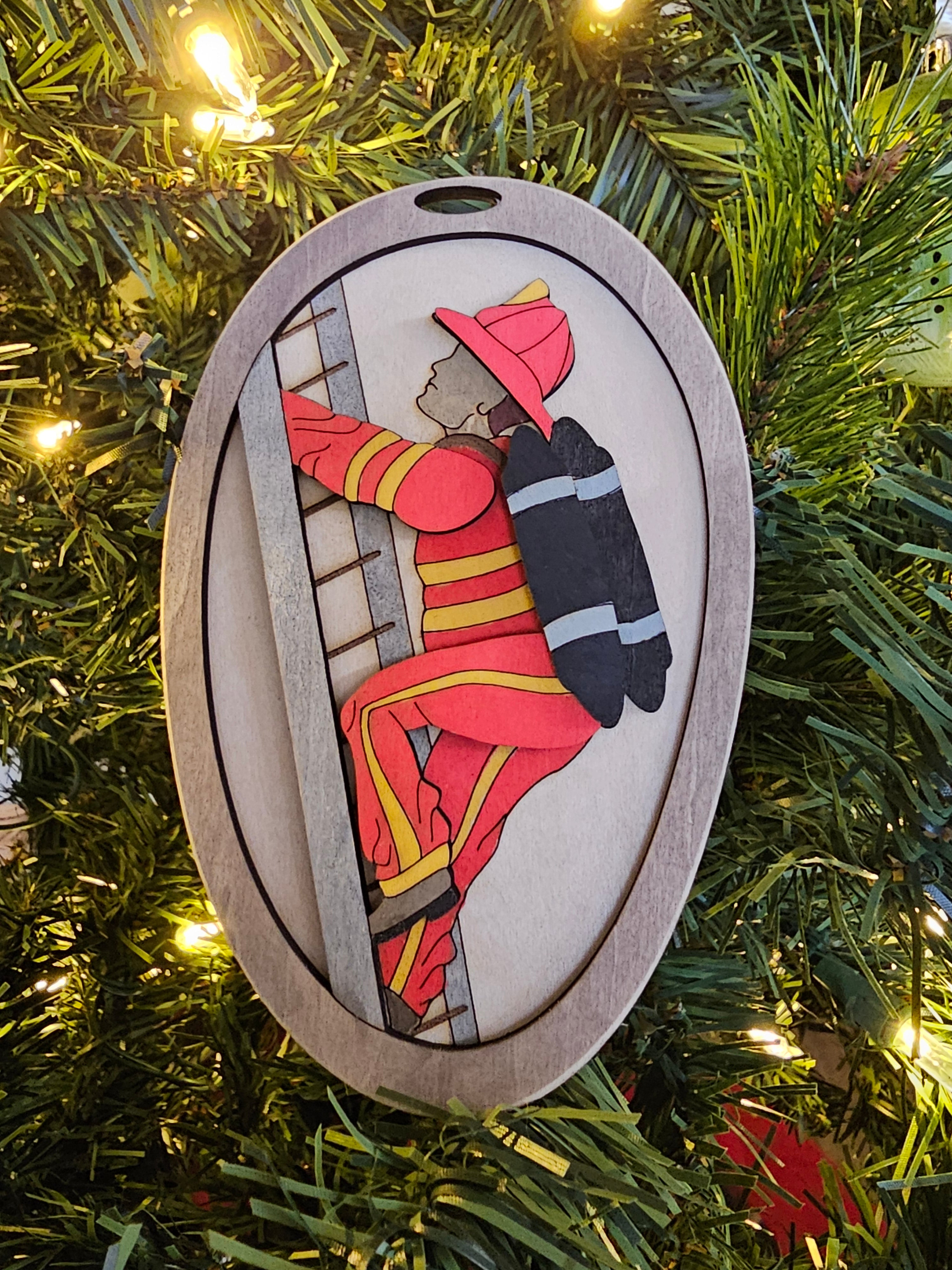 Personalized Fireman Christmas Ornament hanging on a tree