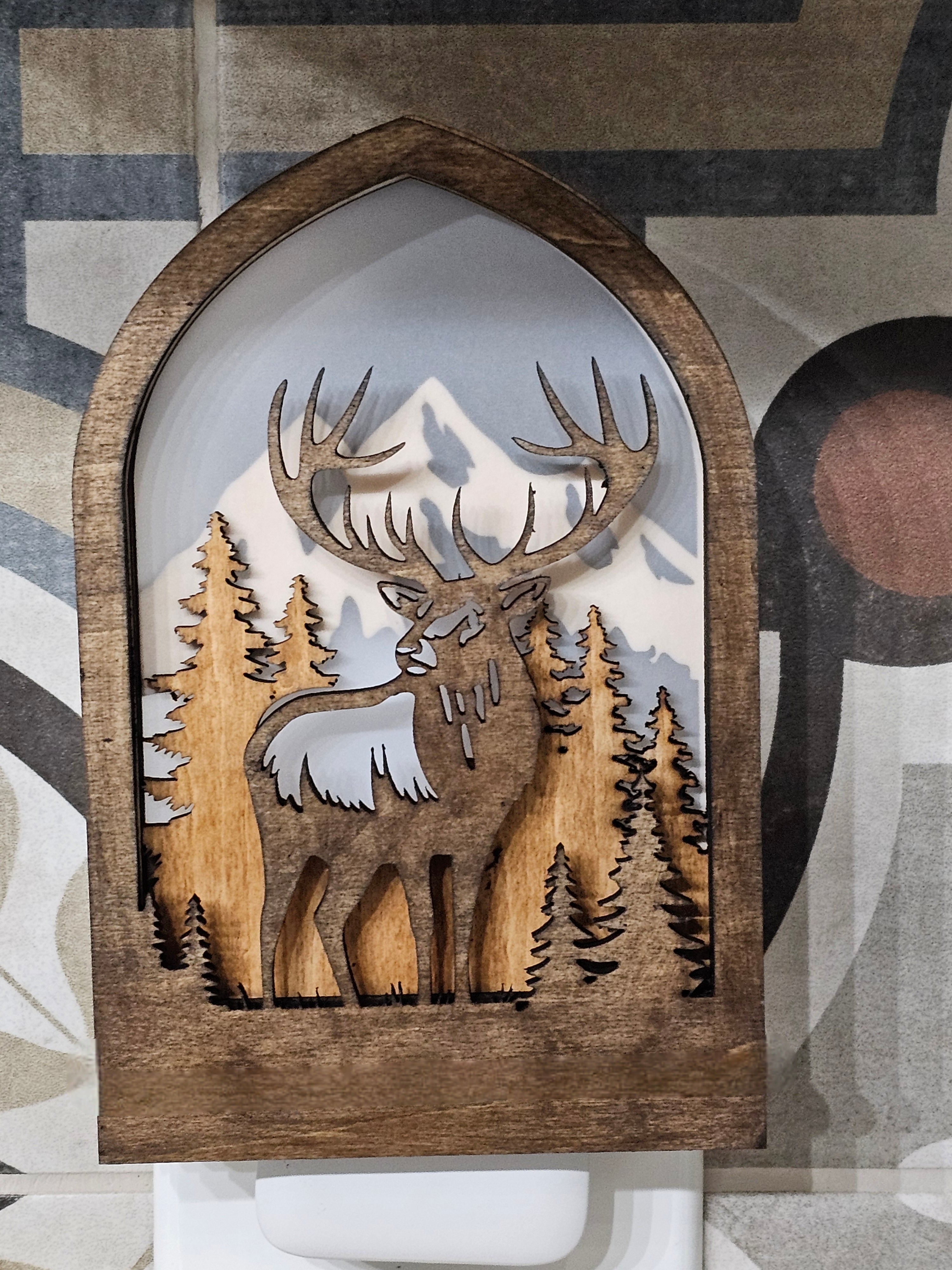 Rustic Elk Night Light glowing in a dark room