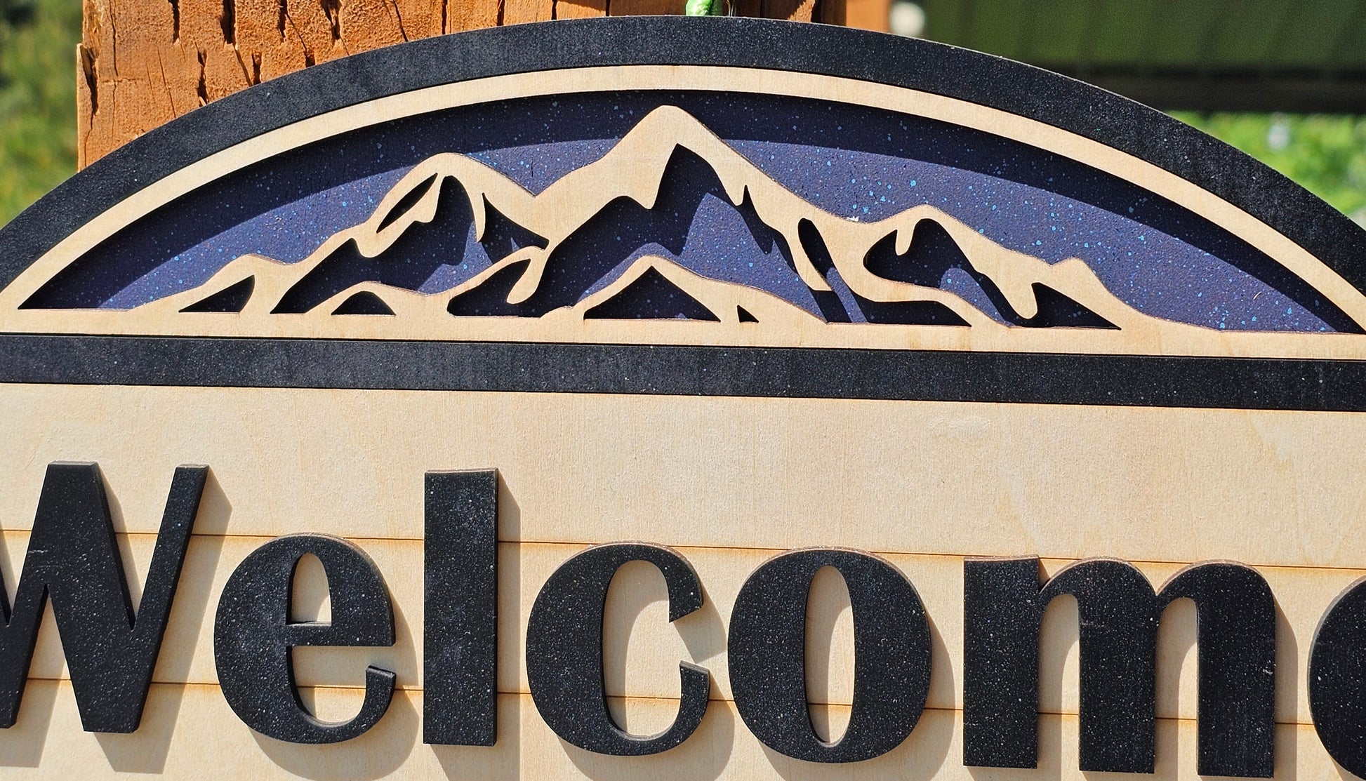 Rustic Welcome Sign with Trees & Mountains