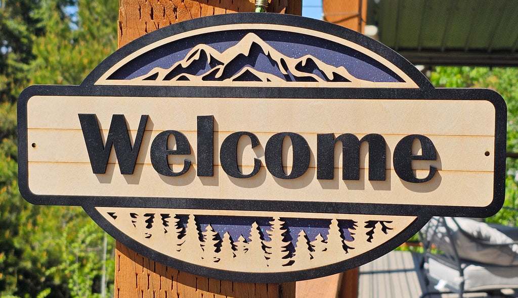 Rustic Welcome Sign with Trees & Mountains