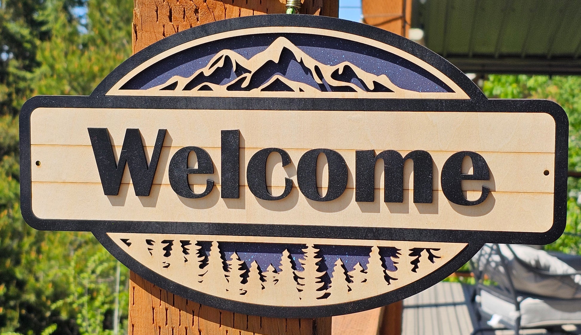Rustic Welcome Sign with Trees & Mountains