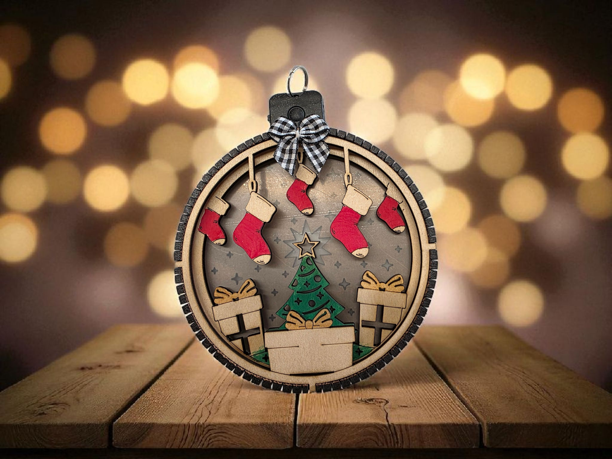 Personalized Lighted Christmas Tree Ornament with Stockings hanging on a tree