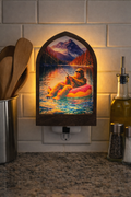 Sasquatch floating in a donut tube fishing night light, dusk to dawn LED