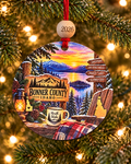 Bonner County Idaho Christmas ornament with signs to Sandpoint, Lake Pend Oreille, Priest Lake and Schweitzer at sunset, 4 inch round wood Christmas ornament with 2026 bead by Bandit Laser
