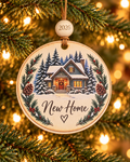 New Home Christmas ornament with snowy cottage, glowing windows and wreath, housewarming gift, 4 inch round wood Christmas ornament with 2026 bead by Bandit Laser