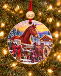 Horse Christmas ornament with chestnut horse, western saddle and red barn at a snowy ranch, 4 inch round wood Christmas ornament with 2026 bead by Bandit Laser
