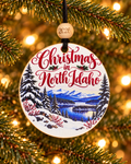 Christmas in North Idaho ornament with snowy lake, evergreens and blue mountains, Idaho souvenir, 4 inch round wood Christmas ornament with 2026 bead by Bandit Laser