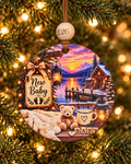 New Baby Christmas ornament with teddy bear, knit booties and BABY blocks at a snowy lake cabin, 4 inch round wood Christmas ornament with 2026 bead by Bandit Laser