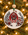 Red barn Christmas ornament with holly wreath, snowy pines and plaid-bow fence posts, 4 inch round wood Christmas ornament with 2026 bead by Bandit Laser