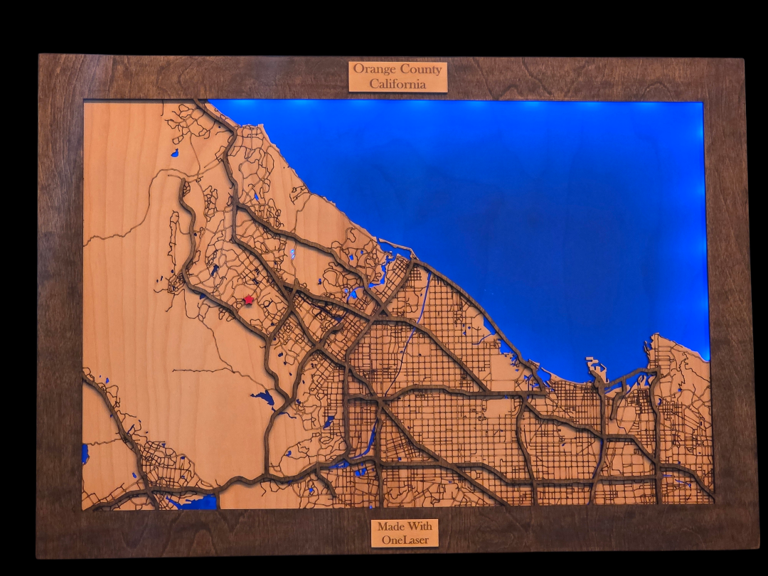Wooden map of Orange County, California with blue background