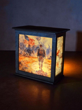 Decorative lamp with a soldier and American flag design on a dark background