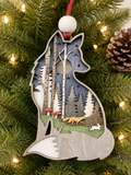 Layered wood fox ornament with birch trees, moon, fox, and rabbit forest scene, hanging on a Christmas tree