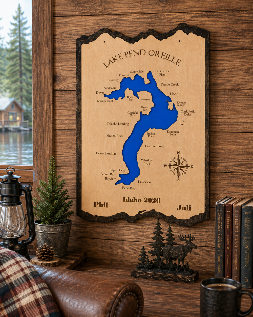 Personalized wooden Lake Pend Oreille map with engraved bay names, hanging on a cabin wall
