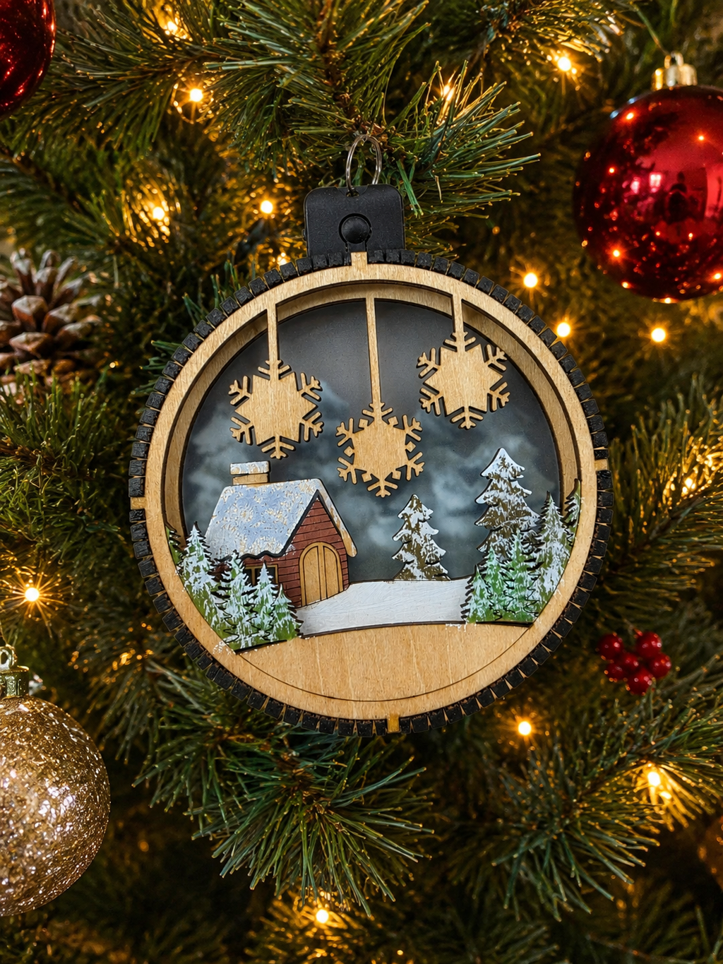 Personalized Cabin Christmas Ornament hanging on a tree