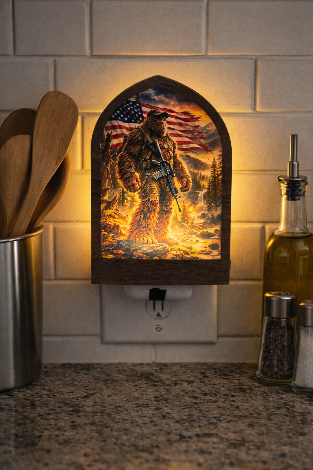 Decorative night light with a sasquatch and American flag design on a kitchen counter.