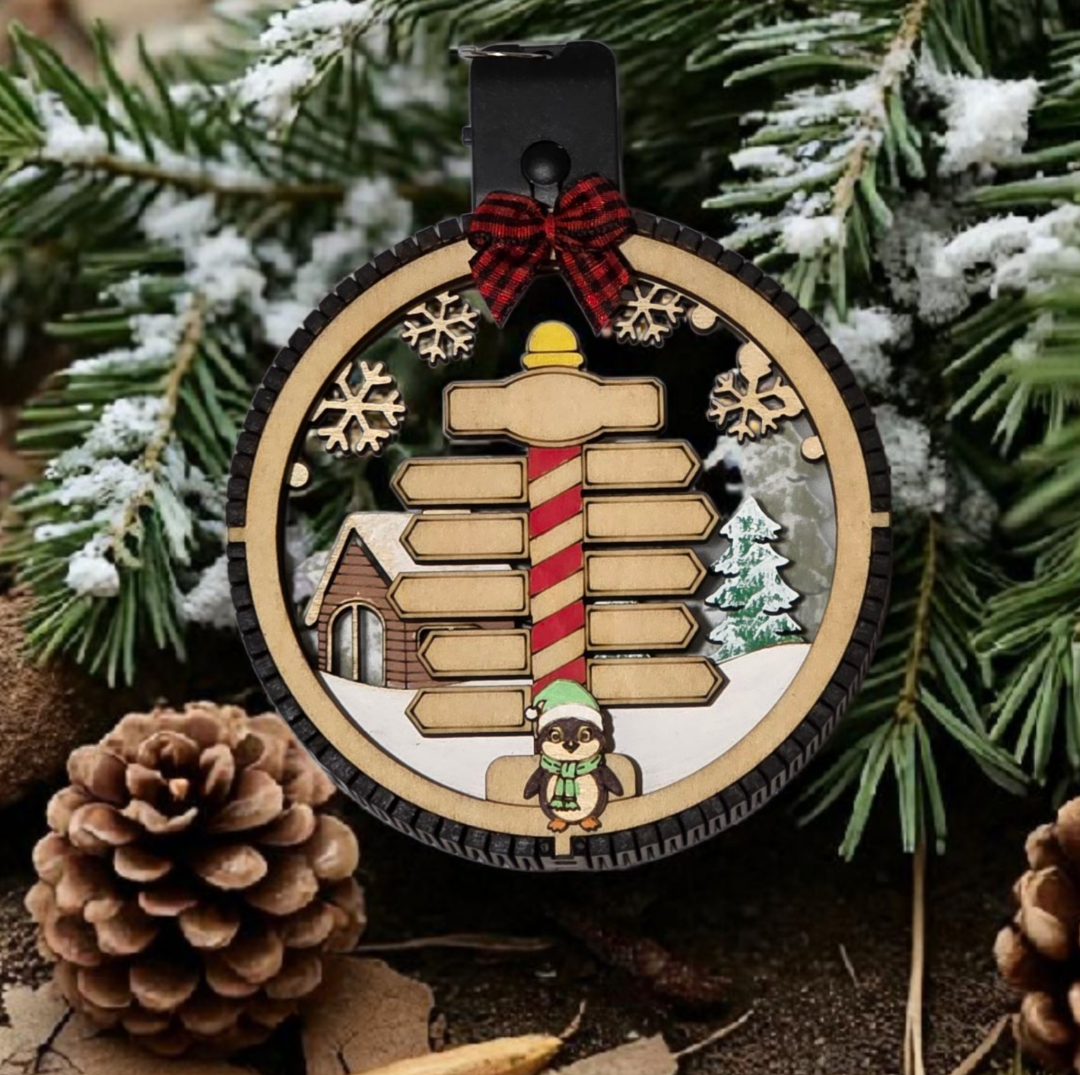 Personalized Lighted North Pole Ornament glowing at night